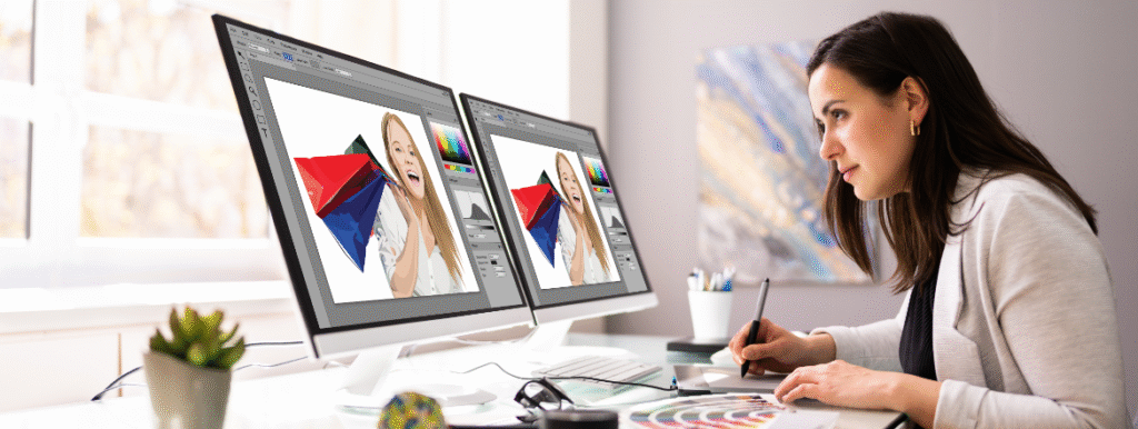 web designer working on project in front of computers